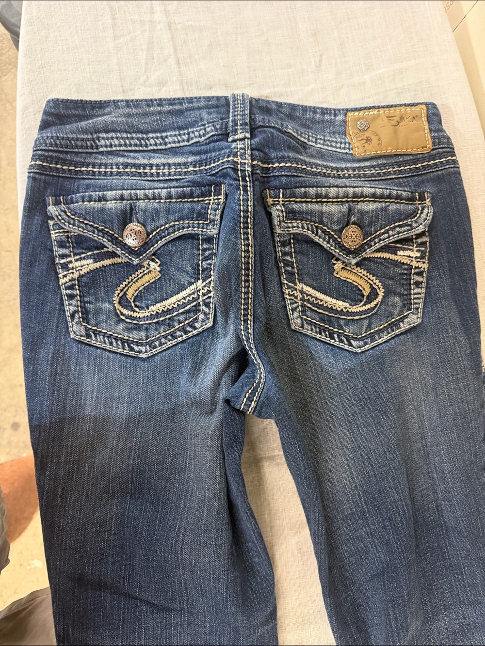 Silver Jeans Blue Bootcut Jeans with Embroidered Back Pockets